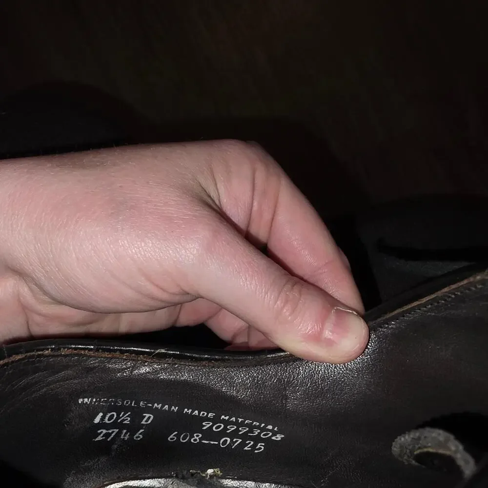 Black leather wingtip dress shoes